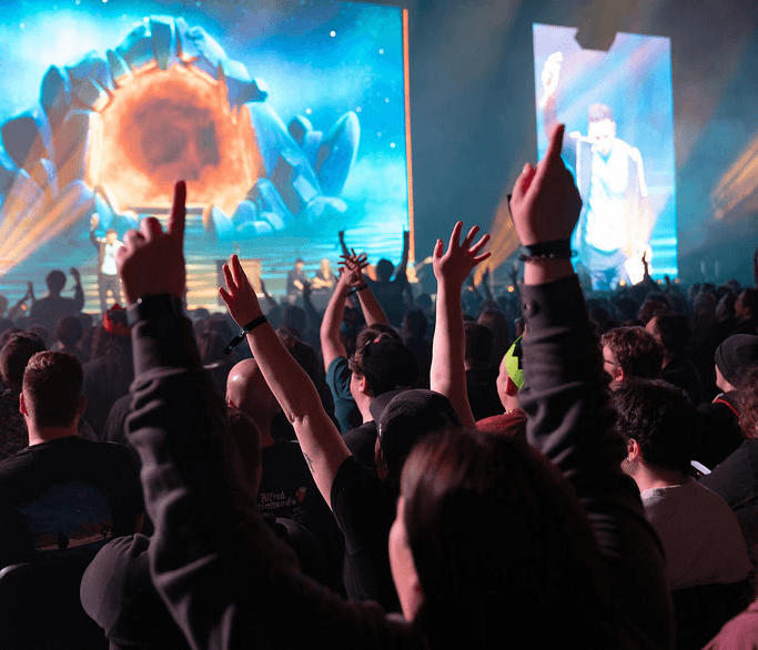 RuneFest crowd watching a keynote presentation — official RuneFest/Jagex event image